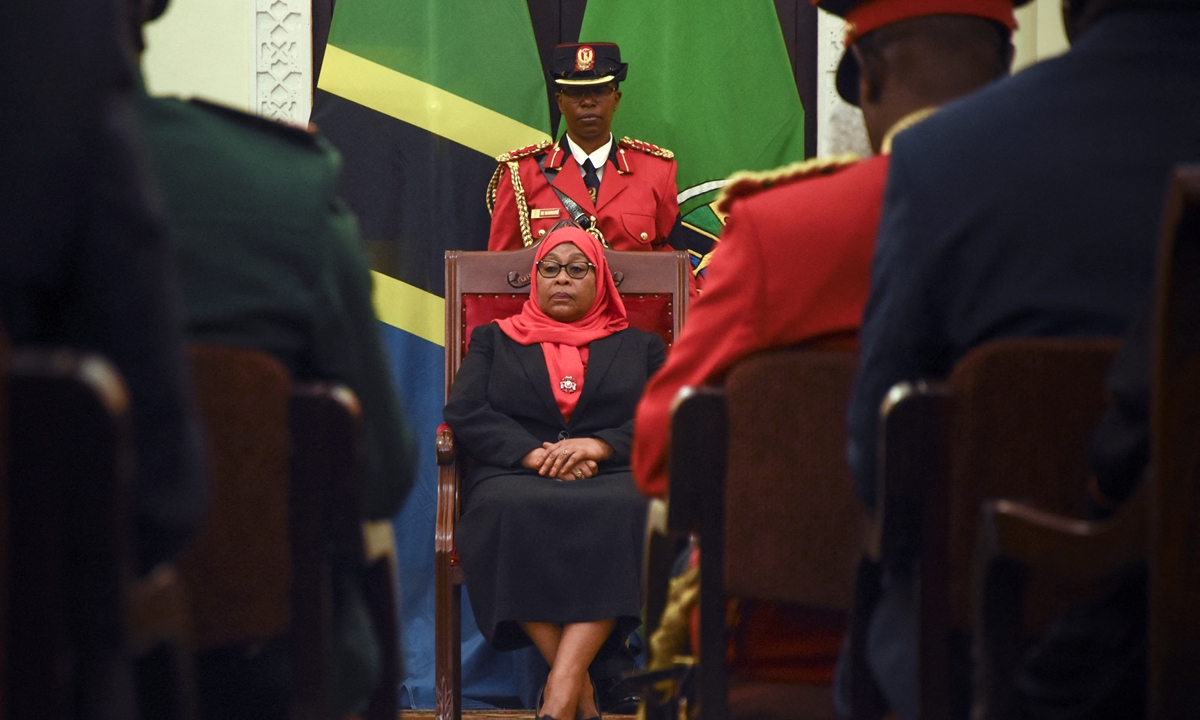 New Tanzanian President Samia Suluhu Hassan sits after being sworn in as the country's first female president, in Dar es Salaam on Friday. Hassan will finish John Magufuli's second five-year term until 2025, after his sudden death.Photo: AFP