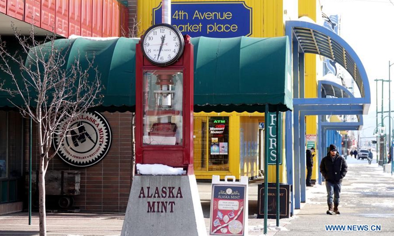 A man walks on the street in Anchorage, Alaska, the United States, March 17, 2021.Photo:Xinhua