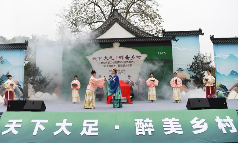 Performers attend the opening ceremony of a tea culture festival held in Dazu District of southwest China's Chongqing Municipality on March 18, 2021. The cultural event is aimed at promoting local tourism. Photo: Xinhua