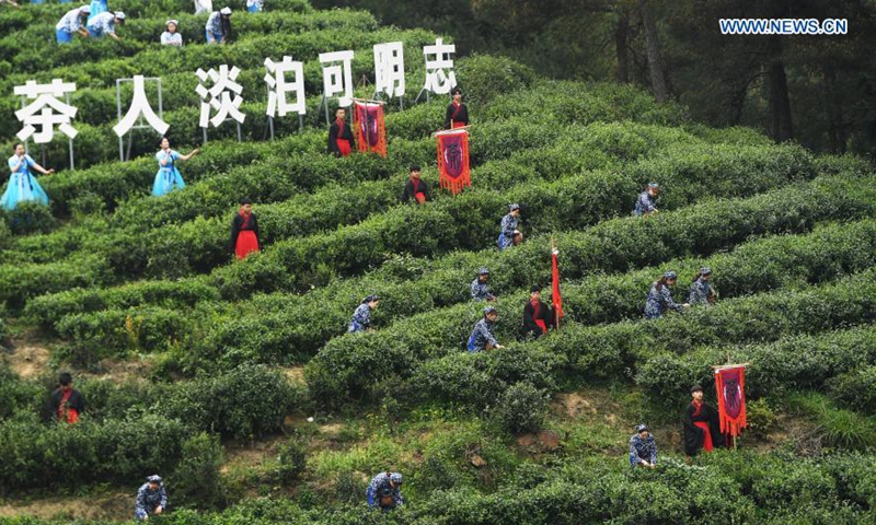 People attend a tea culture festival in Zhongyi Village under Dazu District of southwest China's Chongqing Municipality on March 18, 2021. The cultural event is aimed at promoting local tourism. Photo: Xinhua