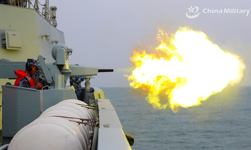 A sailor assigned to a frigate flotilla with the navy under the PLA Northern Theater Command fires the close-in weapons system at mock sea target during a 3-day round-the-clock training exercise in late February. The troops completed training items including gun fire, sea blockade, joint search and rescue, air defense and anti-missile, improving the capability of using weapons under complex situations.(Photo: eng.chinamil.com.cn)