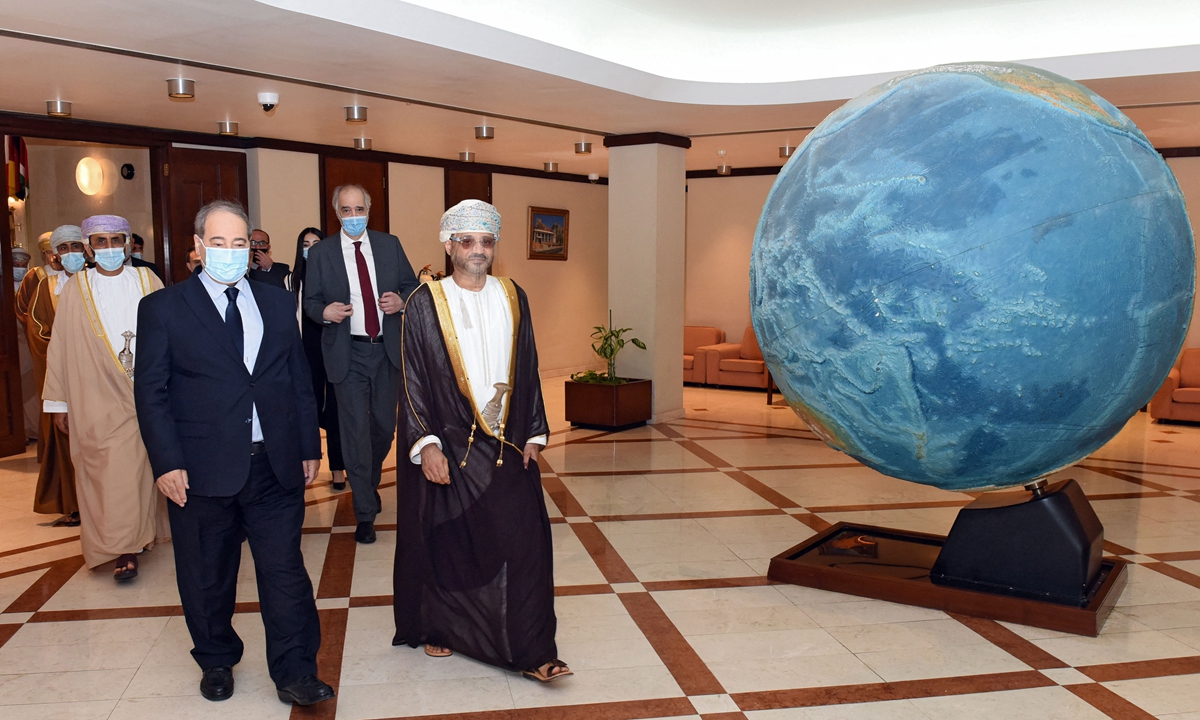 Minister of Foreign Affairs of Oman, Sayyid Badr bin Hamad bin Hamood Al Busaidi (right) meets with Syria's Foreign Minister Faisal Mekdad in the Omani capital Muscat, on Sunday. A statement issued online by Oman News Agency said, 