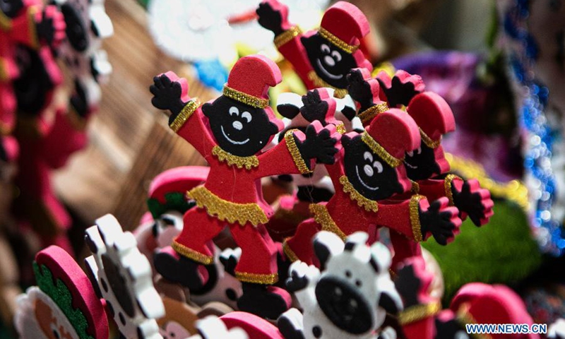 Dolls of Haji Firouz, a traditional character who appears at the start of Nowruz, the Iranian New Year, are displayed for sale at a bazaar ahead of Nowruz in Tehran, Iran, March 18, 2021(Photo: Xinhua)