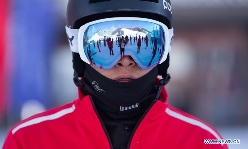 Para snowboarding athlete He Yipeng of China national training team reacts before a training session for the 2022 Paralympic Winter Games at a training base in Chongli District of Zhangjiakou, north China's Hebei Province, March 20, 2021. Para athletes here were busy preparing for the Beijing Winter Paralympic Games, which will be staged between March 4 and 13, 2022. (Xinhua/Cai Yang)