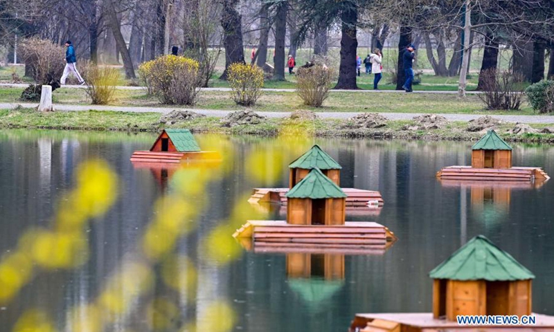 People walk in a park in Skopje, North Macedonia, on March 20, 2021.(Photo: Xinhua)