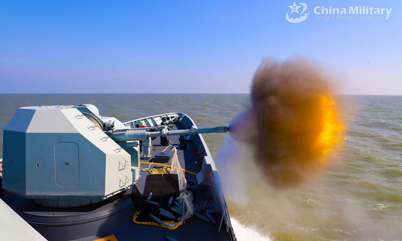 A frigate attached to a naval frigate flotilla under the PLA Northern Theater Command fires its main gun at mock sea targets during a 3-day round-the-clock training exercise in late February. The troops completed training items including gun fire, sea blockade, joint search and rescue, air defense and anti-missile, improving the capability of using weapons under complex situations.(Photo: eng.chinamil.com.cn)