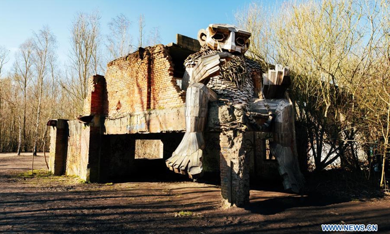 Photo taken on March 20, 2021 shows a troll at the De Schorre forest park in Boom, Belgium. Danish artist Thomas Dambo and his team built seven giant trolls from reclaimed wood at the De Schorre forest park in northern Belgium in 2019. These giant wooden sculptures are dotted around the forest.(Photo: Xinhua)