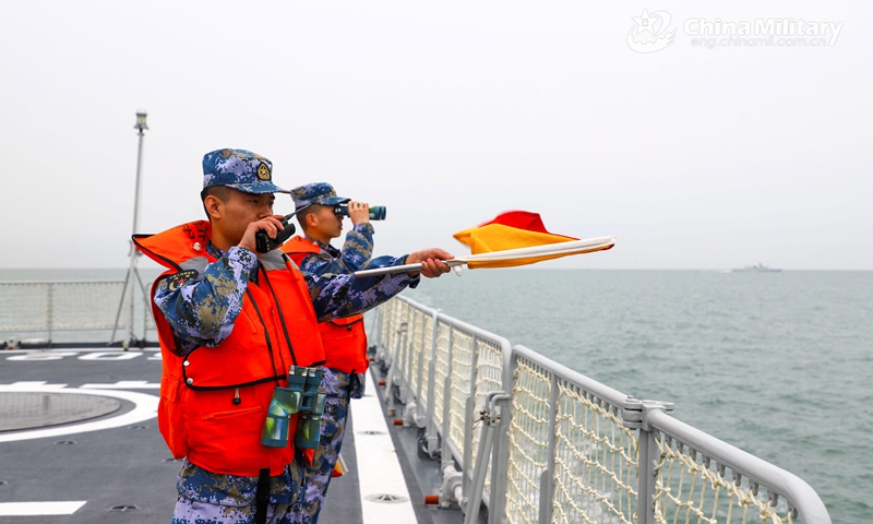 Sailors assigned to a frigate flotilla with the navy under the PLA Northern Theater Command fix on targets’ positions by telescope and give instructions over the wireless intercom during a 3-day round-the-clock training exercise in late February. The troops completed training items including gun fire, sea blockade, joint search and rescue, air defense and anti-missile, improving the capability of using weapons under complex situations.(Photo: eng.chinamil.com.cn)