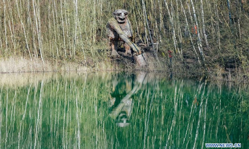 Photo taken on March 20, 2021 shows a troll at the De Schorre forest park in Boom, Belgium. Danish artist Thomas Dambo and his team built seven giant trolls from reclaimed wood at the De Schorre forest park in northern Belgium in 2019. These giant wooden sculptures are dotted around the forest.(Photo: Xinhua)