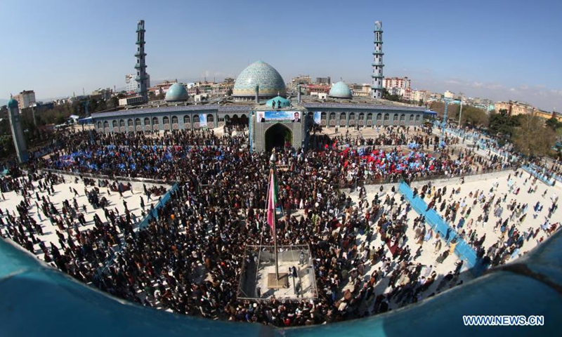 People gather at Hazrat-e-Ali Shrine, or the Blue Mosque, to celebrate the annual Nowruz festival in Mazar-i-Sharif, capital of Balkh province, Afghanistan, March 21, 2021. March 21 is the first day of Nowruz and the start of the year 1400 in Persian calendar. War-weary Afghans marked it with praying for peace as in many mosques, worshippers prayed for ending the war and returning lasting peace in their war-torn country. (Photo by Kawa Basharat/Xinhua)