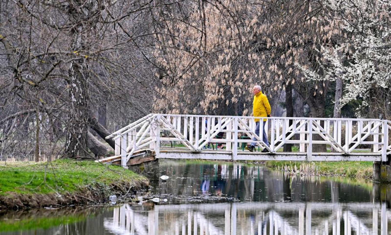 A man walks in a park in Skopje, North Macedonia, on March 20, 2021.(Photo: Xinhua)