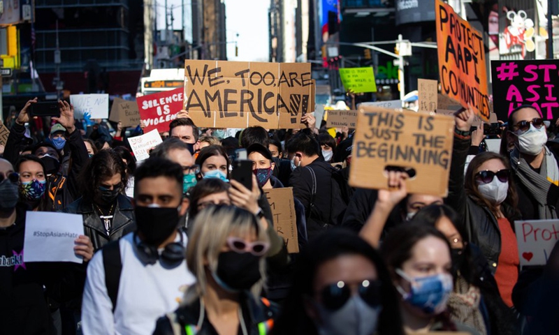Demonstrators march during a protest against Asian hate on Times Square in New York, the United States, March 20, 2021.(Photo: Xinhua)