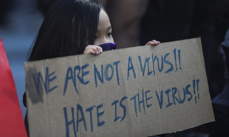 A girl takes part in a protest against Asian hate in New York, the United States, on March 21, 2021.(Photo: Xinhua)