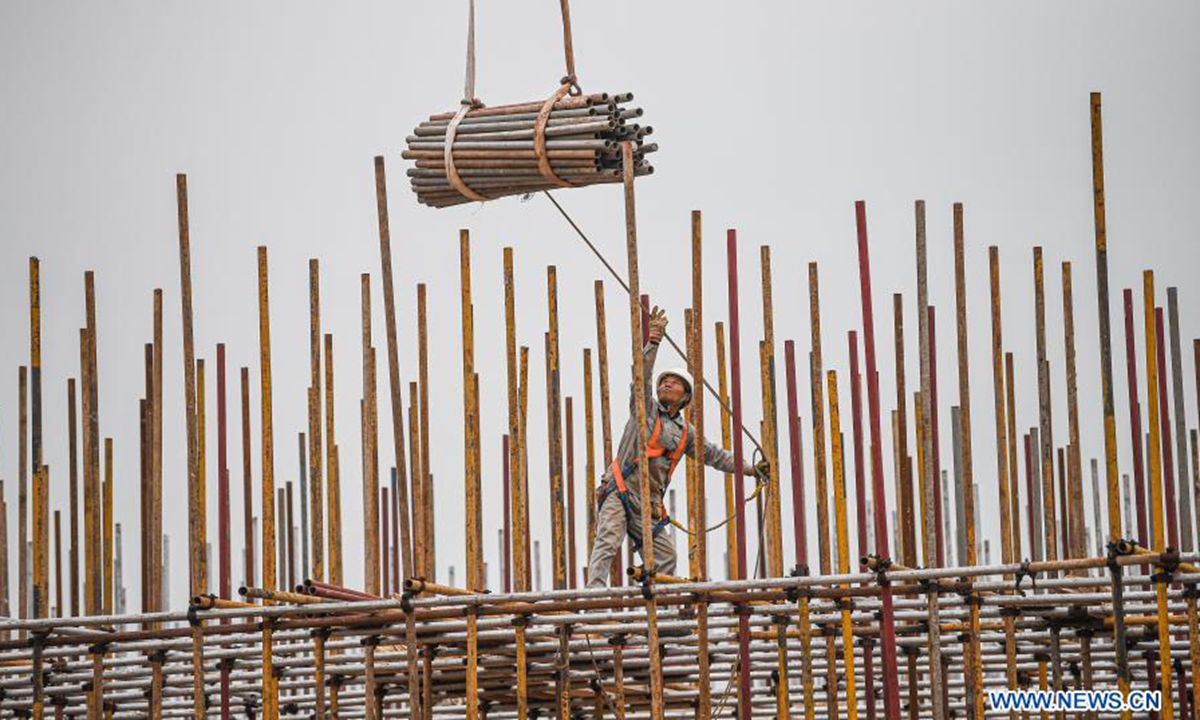 A worker is seen at a Sinopec construction site in Yangpu Economic Development Zone, south China's Hainan Province, March 23, 2021. The 1,000 KTA Ethylene and Oil Refinery Reconstruction & Extension Project of Sinopec Hainan Refining & Chemical Co., Ltd., located in Yangpu Economic Development Zone, a key park of Hainan Free Trade Port, is progressing in an orderly manner recently.  (Xinhua/Pu Xiaoxu)
