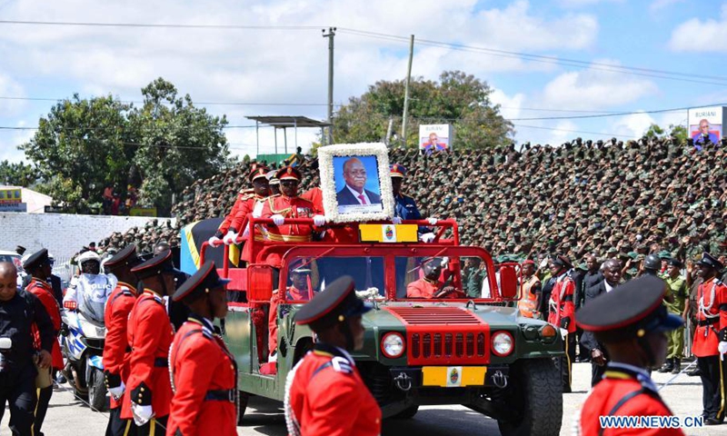 Soldiers on a ceremonial vehicle escort the casket of former Tanzanian President John Magufuli in Dodoma, capital of Tanzania, on March 22, 2021. Tanzania held a state funeral for John Magufuli at the Jamhuri Stadium in Dodoma on Monday, with the attendance of African leaders, representatives and other dignitaries. Magufuli, 61, died in office from a heart condition on March 17 in the country's commercial capital Dar es Salaam.(Photo: Xinhua)