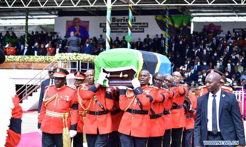 Soldiers carry the casket of former Tanzanian President John Magufuli in Dodoma, capital of Tanzania, on March 22, 2021. Tanzania held a state funeral for John Magufuli at the Jamhuri Stadium in Dodoma on Monday, with the attendance of African leaders, representatives and other dignitaries. Magufuli, 61, died in office from a heart condition on March 17 in the country's commercial capital Dar es Salaam.(Photo: Xinhua)