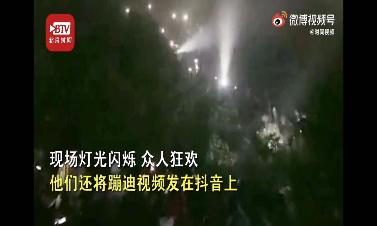 Screenshot of a video clip showing a gathering in which around 200 tourists went clubbing at the top of a mountain. Photo: BTV