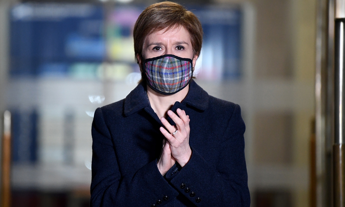 Scotland's First Minister Nicola Sturgeon takes part in a doorstep clap in memory of Captain Sir Tom Moore at St Andrews House on February 3, 2021 in Edinburgh, Scotland. Photo: VCG