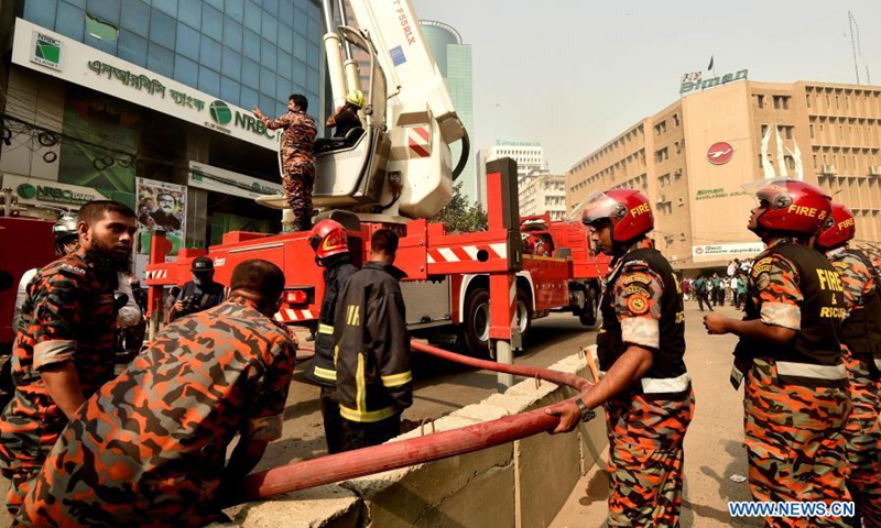 Firefighters use a water hose to douse a massive fire in a high-rise building in the Motijheel commercial area in Dhaka, Bangladesh, March 22, 2021. A fire engulfed a high-rise building here on Monday afternoon.(Photo: Xinhua)