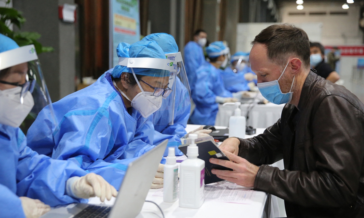 Foreign reporters sign up for Sinopharm’s vaccines in Beijing on Tuesday. The Chinese Foreign Ministry confirmed on Wednesday that around 150 reporters from 27 countries’ 71 news organizations had received Chinese vaccines on Tuesday in the Chinese capital. Photo: AFP