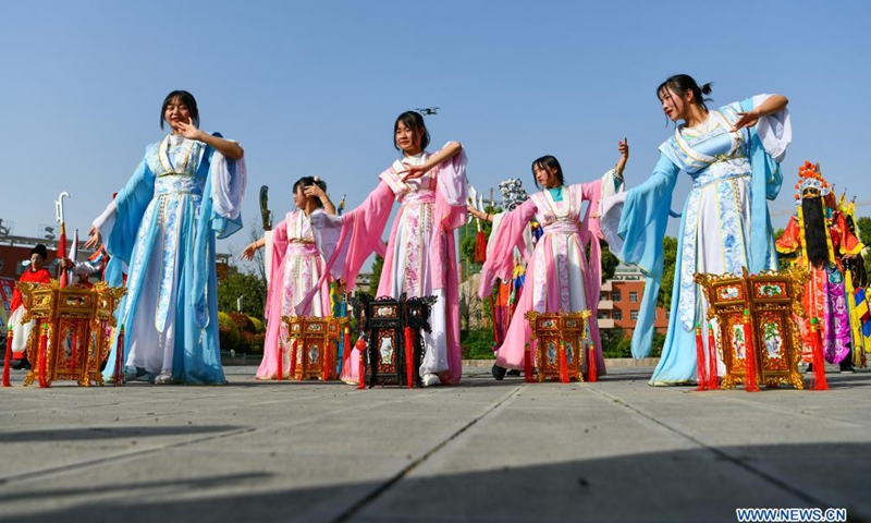 Students and teachers rehearse the traditional opera Taiping Huadengxi of Longli County at the No. 3 Middle School of Longli County, Qiannan Buyi and Miao Autonomous Prefecture, southwest China's Guizhou Province, March 23, 2021. In order to pass on and protect the traditional opera Taiping Huadengxi of Longli County, the No. 3 Middle School of Longli County has invited inheritors of the opera to give regular lessons to students. (Xinhua)