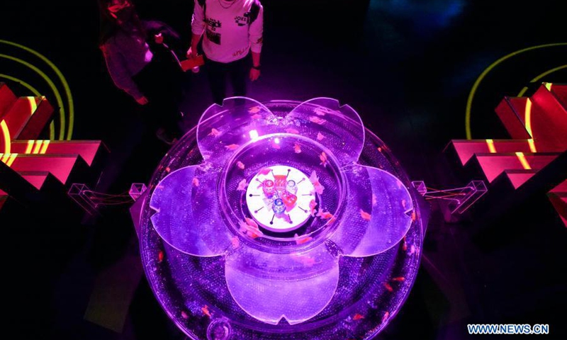 People visit a goldfish exhibition at the Art Aquarium Museum in Tokyo, Japan, March 24, 2021. The exhibition is on view from March 6 to May 9.(Photo: Xinhua)