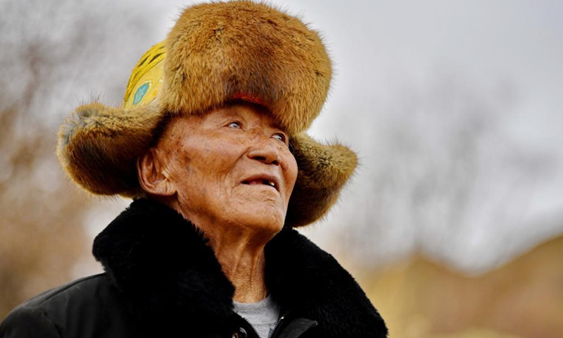 Photo taken on March 21, 2021 shows a portrait of Basang in Xigaze, southwest China's Tibet Autonomous Region. Basang, born in 1934, is a villager of Taye Village in Xigaze, China's Tibet Autonomous Region. In the old times, the family of Basang had to pay various taxes to serf owners, which made the family lead a miserable life. (Photo:Xinhua)