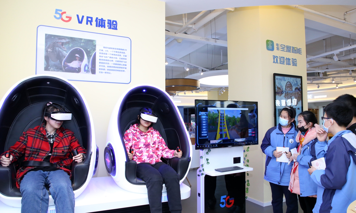 Students get a taste of virtual reality (VR) with 5G technology in a smart experience center in Hefei, East China's Anhui Province on Thursday. China's telecoms carriers have been providing 5G plus VR service to customers since last year. Photo: cnshphoto