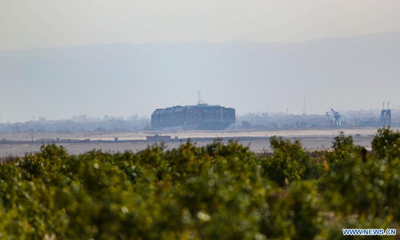 Photo taken on March 25, 2021 shows the grounded container ship Ever Given on the Suez Canal, Egypt. Egypt's Suez Canal Authority (SCA) said on Thursday that it has temporarily suspended navigation through the world's busiest shipping course until the grounded cargo ship is completely freed.Photo:Xinhua