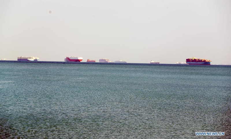 Ships wait to pass the Suez Canal on the Great Bitter Lake, in the province of Ismailia, Egypt, March 25, 2021. Egypt's Suez Canal Authority (SCA) said on Thursday that it has temporarily suspended navigation through the world's busiest shipping course until the grounded cargo ship is completely freed. Photo:Xinhua