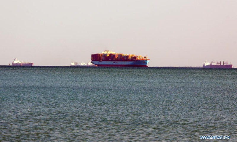 Ships wait to pass the Suez Canal on the Great Bitter Lake, in the province of Ismailia, Egypt, March 25, 2021. Egypt's Suez Canal Authority (SCA) said on Thursday that it has temporarily suspended navigation through the world's busiest shipping course until the grounded cargo ship is completely freed.Photo:Xinhua
