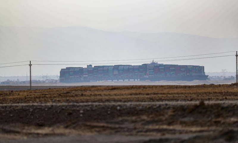 Photo taken on March 25, 2021 shows the grounded container ship Ever Given on the Suez Canal, Egypt. Egypt's Suez Canal Authority (SCA) said on Thursday that it has temporarily suspended navigation through the world's busiest shipping course until the grounded cargo ship is completely freed.Photo:Xinhua