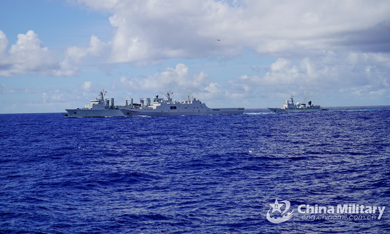 Three warships attached to a naval flotilla under the PLA Southern Theater Command, including the amphibious dock landing ship Wuzhishan (Hull 987) and comprehensive supply ship Chaganhu (Hull 967) , steam in formation during a combined arms training exercise. The flotilla under training has traveled more than 8,000 nautical miles in over 30 days, conducting dozes of training items including air and missile defense, anti-terrorism and anti-piracy operation, and joint search and rescue.   Photo: China Military Online