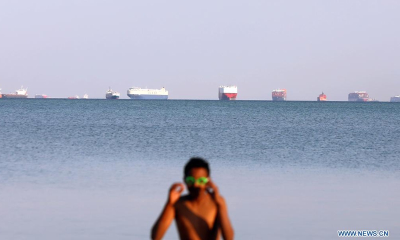 Ships wait to pass the Suez Canal on the Great Bitter Lake, in the province of Ismailia, Egypt, March 25, 2021. Egypt's Suez Canal Authority (SCA) said on Thursday that it has temporarily suspended navigation through the world's busiest shipping course until the grounded cargo ship is completely freed.Photo:Xinhua