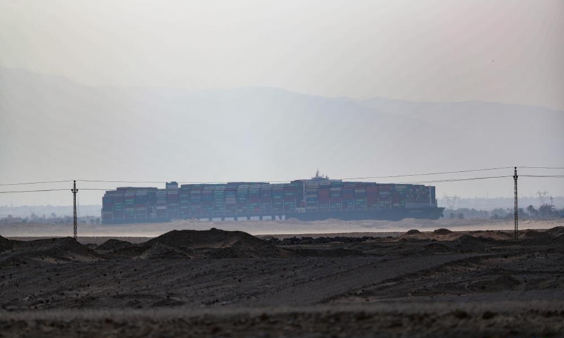 Photo taken on March 25, 2021 shows the grounded container ship Ever Given on the Suez Canal, Egypt. Egypt's Suez Canal Authority (SCA) said on Thursday that it has temporarily suspended navigation through the world's busiest shipping course until the grounded cargo ship is completely freed.Photo:Xinhua