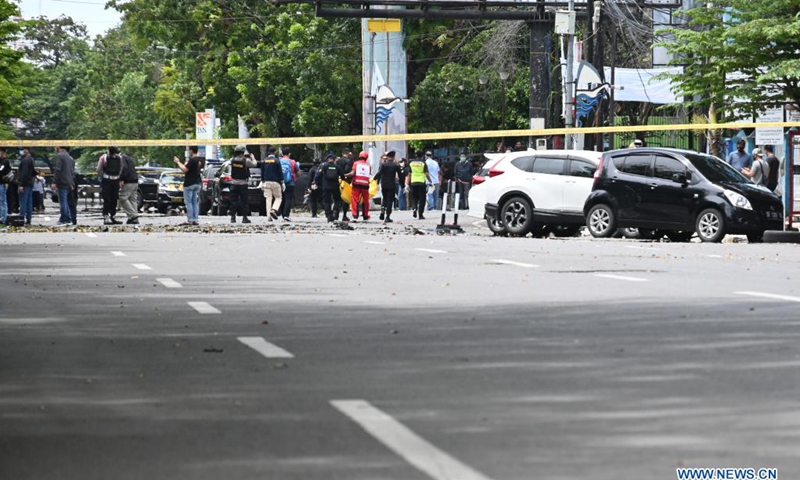 Indonesian police officers block off a Cathedral church in Makassar, South Sulawesi, Indonesia, March 28, 2021. The Indonesian police have suspected that two people committed a suicide bombing outside the Cathedral in the port city of Makassar, capital of South Sulawesi province in east Indonesia on Sunday morning, injuring at least 14 people. 