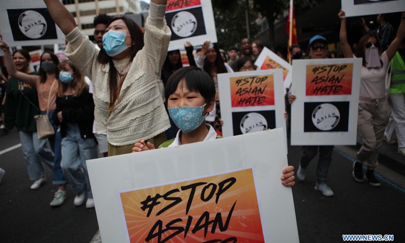 People rally for the Stop Asian Hate movement in Auckland, New Zealand, March 27, 2021. Hundreds of people gathered at the Aotea Square in Auckland CBD to speak out their anger against the racism towards Asians in the United States and New Zealand, before marching along the Queen Street.(Photo: Xinhua)