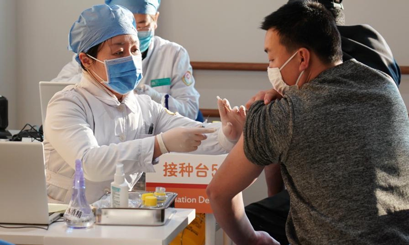 People are inoculated with the COVID-19 vaccines at a healthcare center in Honglian Community in Xicheng District of Beijing, capital of China, Jan. 3, 2021. Beijing has started administering COVID-19 vaccines among specific groups of people with higher infection risks.(Photo: Xinhua)