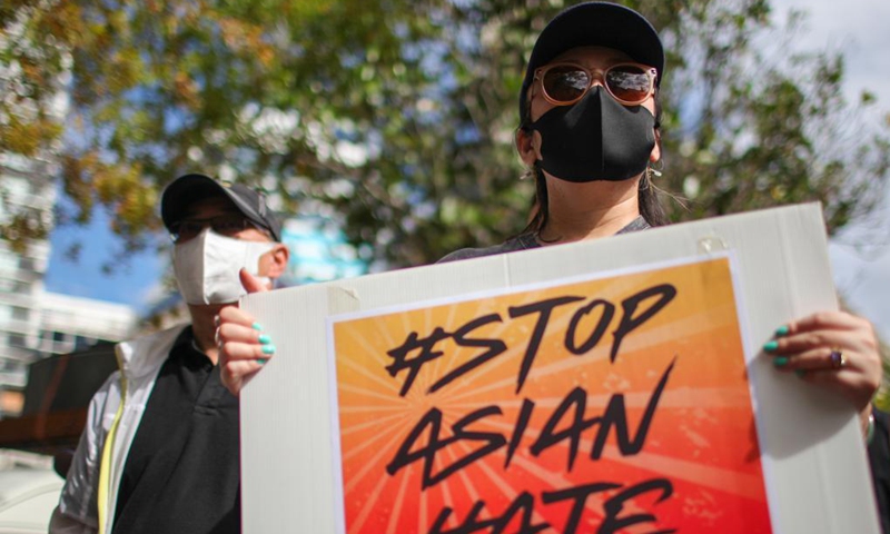 People rally for the Stop Asian Hate movement in Auckland, New Zealand, March 27, 2021. Hundreds of people gathered at the Aotea Square in Auckland CBD to speak out their anger against the racism towards Asians in the United States and New Zealand, before marching along the Queen Street.(Photo: Xinhua)