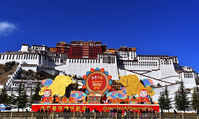 Decorations for the Spring Festival and the Tibetan New Year are seen in front of the Potala Palace in Lhasa, capital of southwest China's Tibet Autonomous Region, Feb. 8, 2021.(Photo: Xinhua)