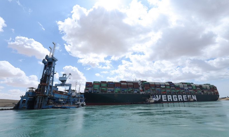 Rescue vessels work at the site of a container ship trapped on the Suez Canal of Egypt on March 26, 2021.(Photo: Xinhua)