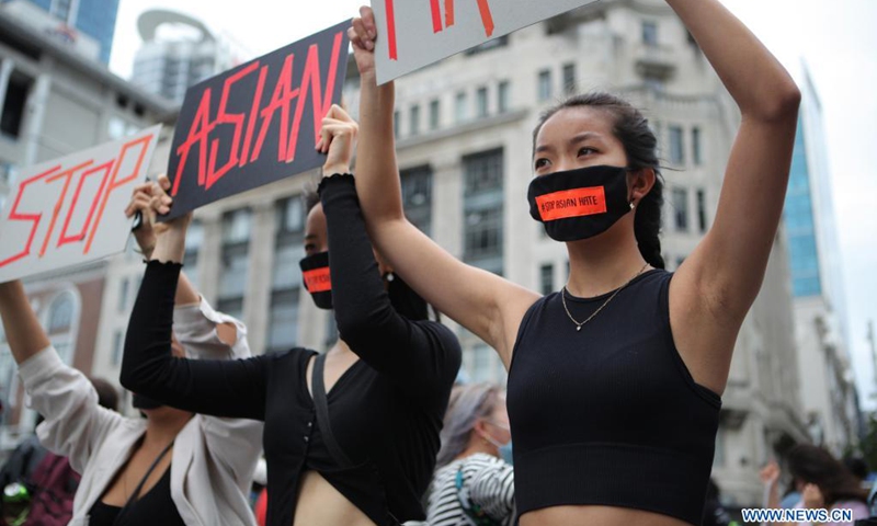 People rally for the Stop Asian Hate movement in Auckland, New Zealand, March 27, 2021. Hundreds of people gathered at the Aotea Square in Auckland CBD to speak out their anger against the racism towards Asians in the United States and New Zealand, before marching along the Queen Street.(Photo: Xinhua)