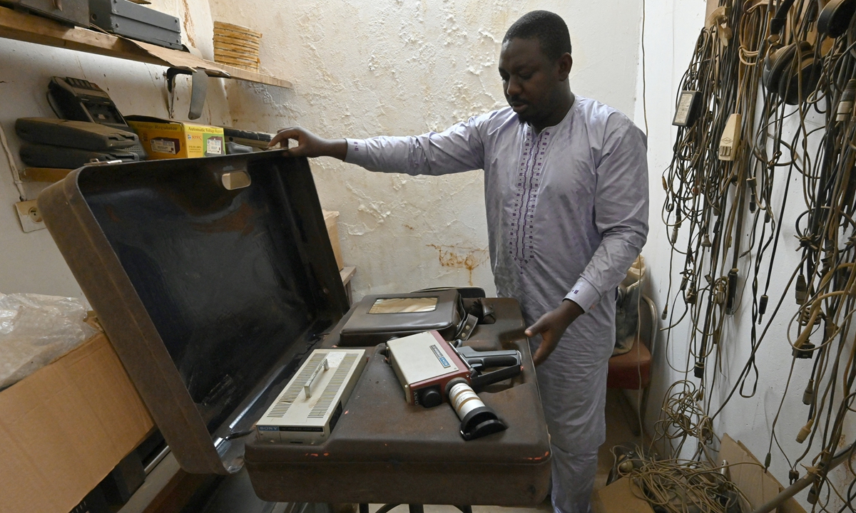 A man shows off equipment and film in the late French ethnographer and filmmaker Jean Rouch's editing room at the Institute for Research in Human Sciences in Niamey, Niger, on February 22. Photos: AFP