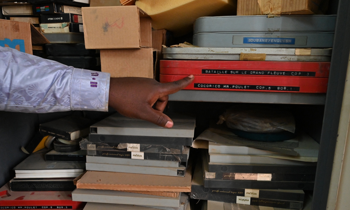 A man shows off equipment and film in the late French ethnographer and filmmaker Jean Rouch's editing room at the Institute for Research in Human Sciences in Niamey, Niger, on February 22. Photos: AFP