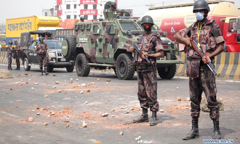Members of the Border Guard Bangladesh (BGB) stand guard on a street during a countrywide protest in Narayanganj, Bangladesh, March 28, 2021. Parts of Bangladesh including capital Dhaka continued to be affected by protests called by a religious group. At least 10 people were injured on Sunday.(Photo: Xinhua)