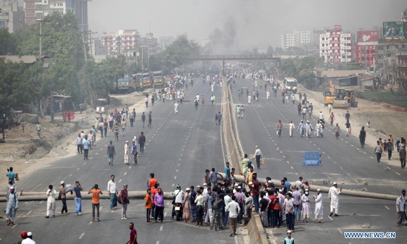 People block a road during a countrywide protest in Narayanganj, Bangladesh, March 28, 2021. Parts of Bangladesh including capital Dhaka continued to be affected by protests called by a religious group. At least 10 people were injured on Sunday. (Photo: Xinhua)