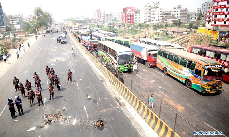Members of the Border Guard Bangladesh (BGB) stand guard on a street during a countrywide protest in Narayanganj, Bangladesh, March 28, 2021. Parts of Bangladesh including capital Dhaka continued to be affected by protests called by a religious group. At least 10 people were injured on Sunday.(Photo: Xinhua)