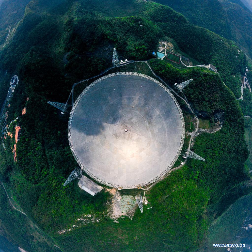 Aerial photo taken on March 28, 2021 shows China's Five-hundred-meter Aperture Spherical radio Telescope (FAST) under maintenance in southwest China's Guizhou Province. FAST has identified over 300 pulsars so far. Located in a naturally deep and round karst depression in southwest China's Guizhou Province, it officially began operating on Jan. 11, 2020. Photo: Xinhua
