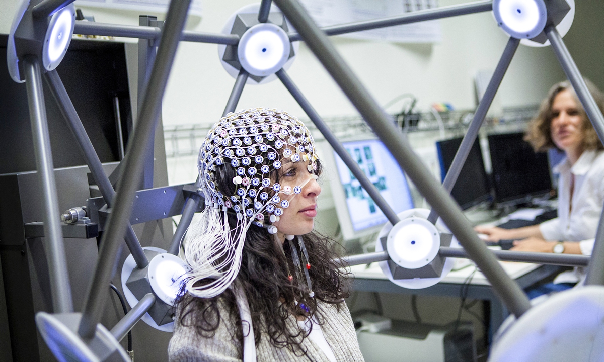 Researchers use electroencephalography on a person to measure brain activity. Photo: AFP