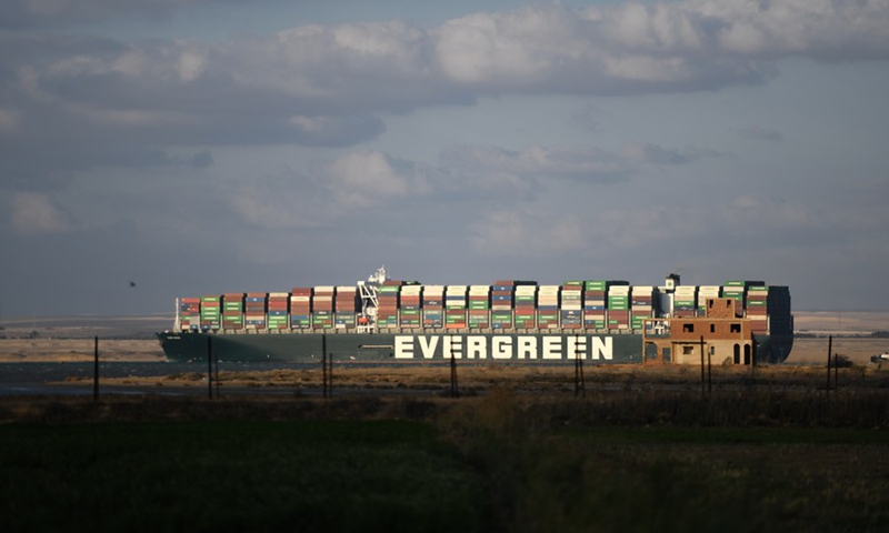 Photo taken on March 29, 2021 shows the container ship Ever Given moving on the Suez Canal, Egypt.(Photo: Xinhua)